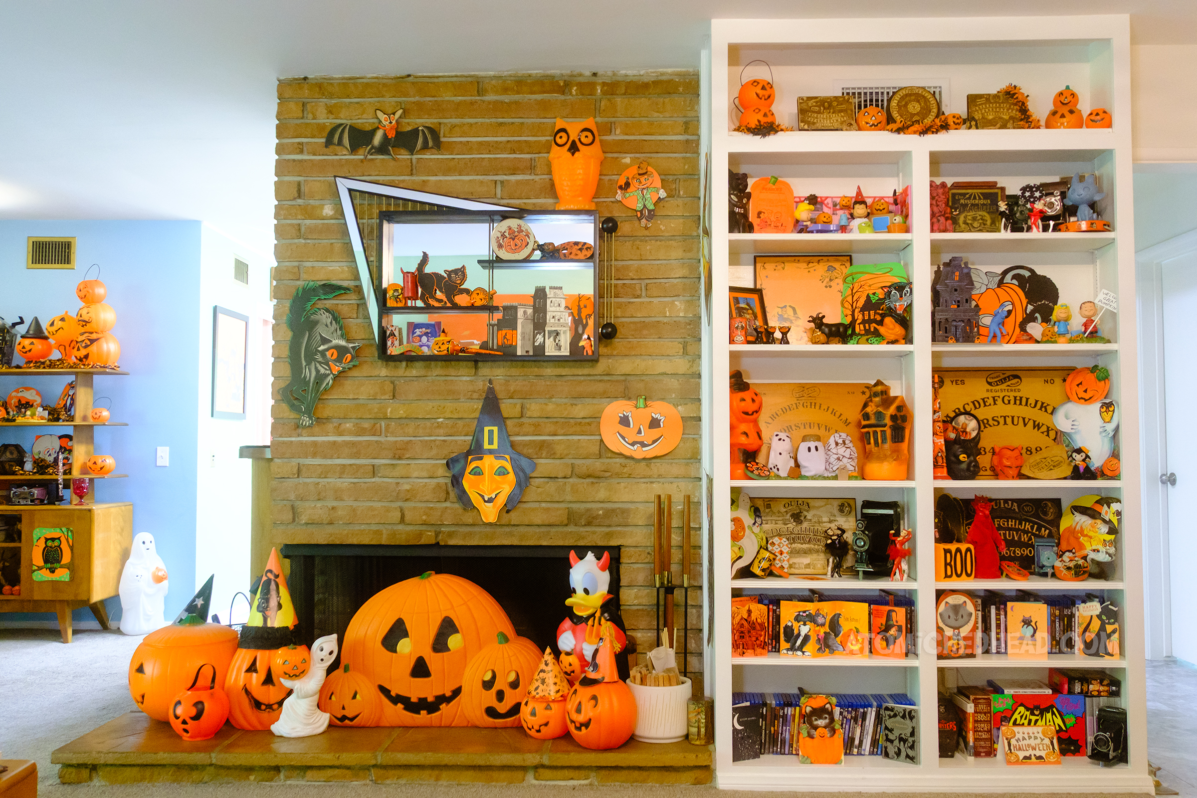 Overall of the fireplace and built in bookcase.