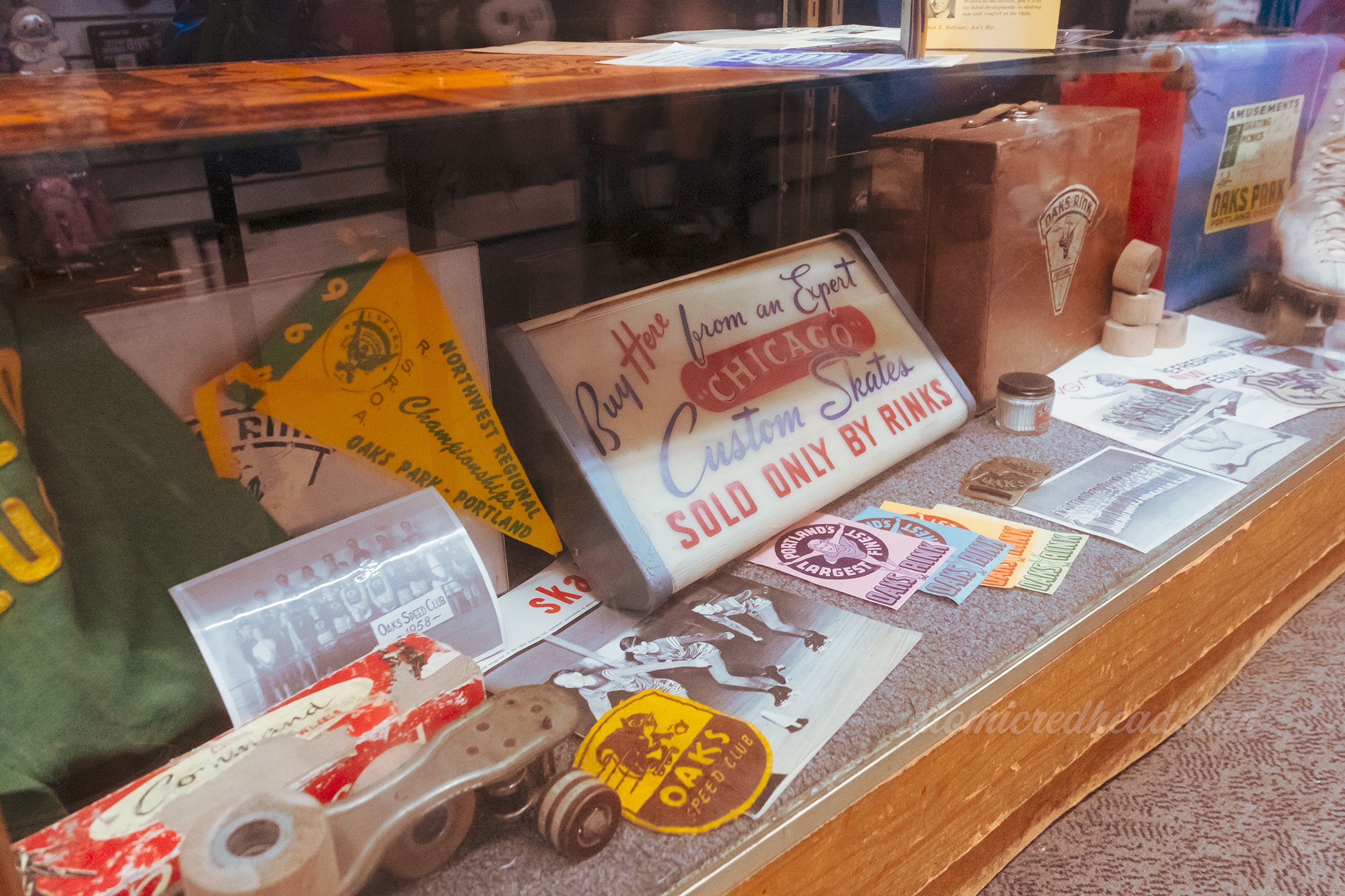 A display case with artifacts from the roller rink.