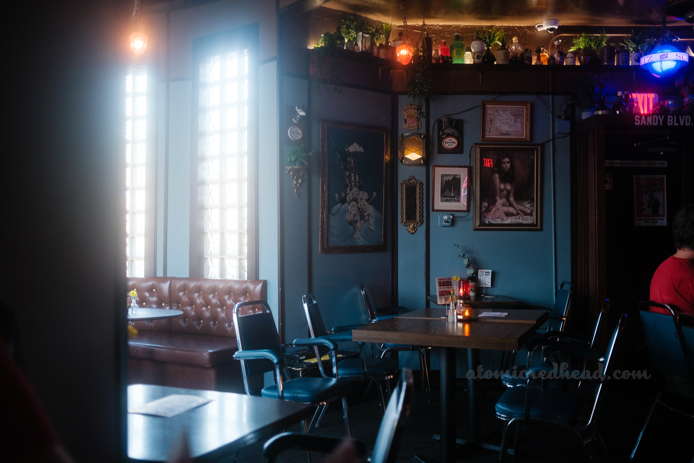 Interior where the building transitions from the rounded bottle shaped room to a larger space.