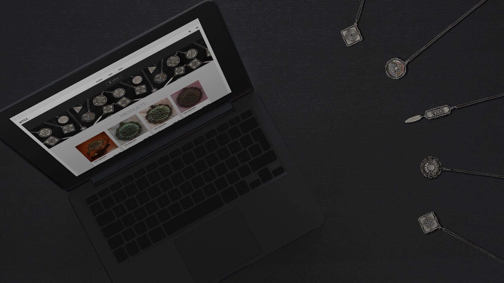Black MacBook. ATTCK.com e-commerce page