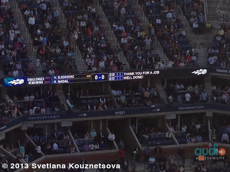 A scoreboard showing a score and open captions saying: