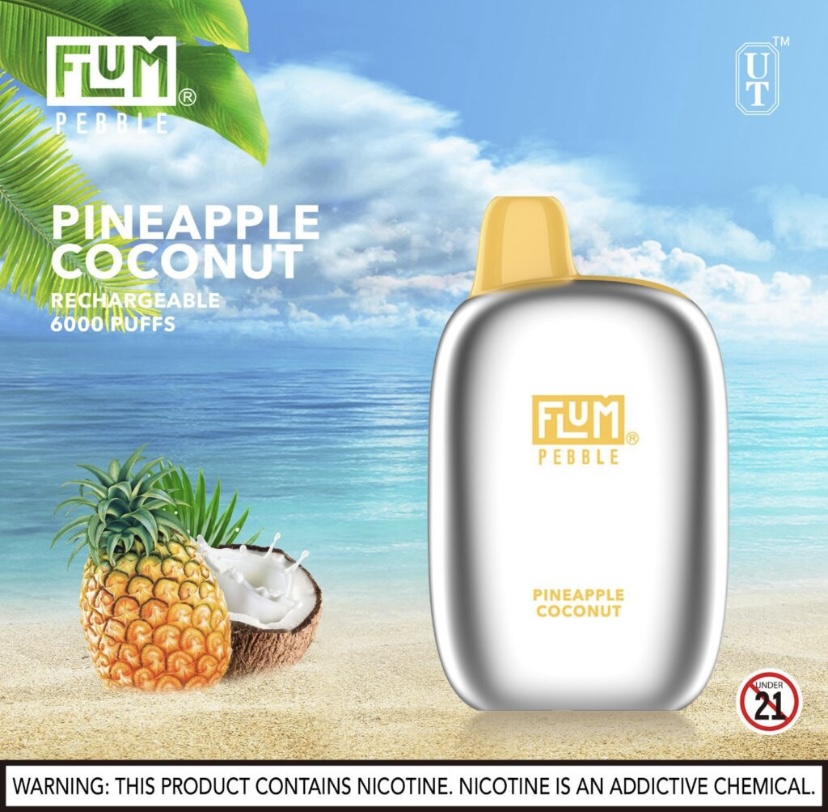 Flum Pebble Pineapple Coconut Nicotine Vape Device on a Tropical Beach Backdrop with Pineapple and Coconut Next to It - Australia E-cigarette Store