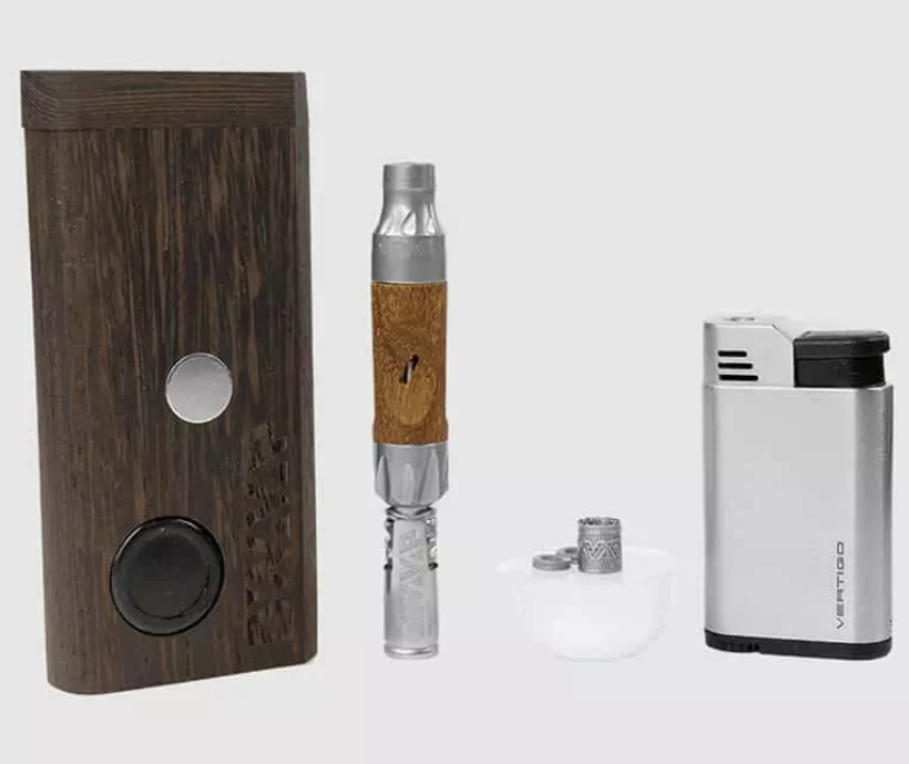 Vape kit with a wooden-mod device, a metal-tipped glass tank, and a portable charger on a light gray background.
