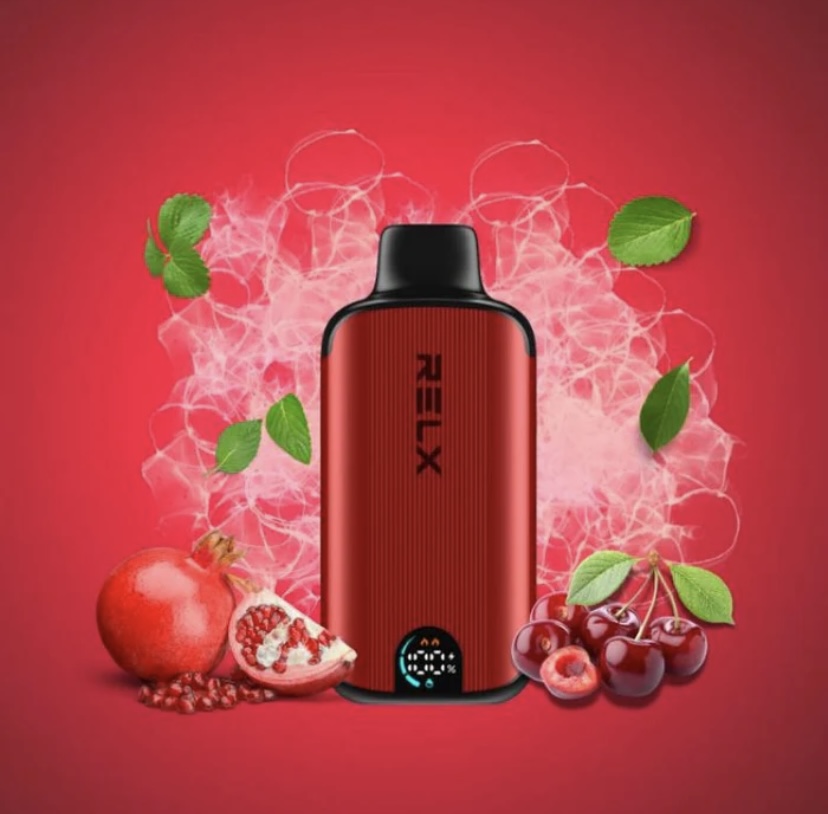 Red Relx Vape Device Standing Upright with Pomegranate Pomegranate Seeds and Cherries on a Red Background with Green Leaves - Australia E-cigarette Store