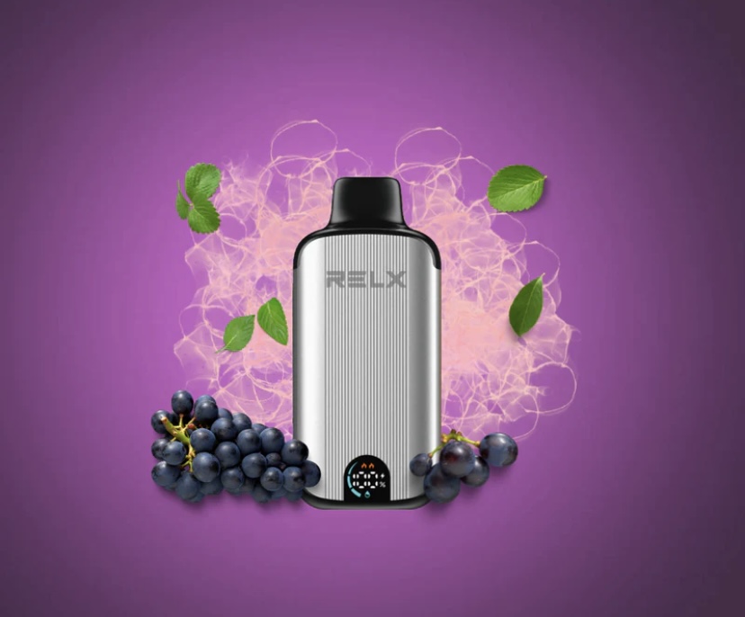 Silver Vape Device with Black Mouthpiece Surrounded by Grapes and Green Leaves Against a Purple Background - Australia E-cigarette Store