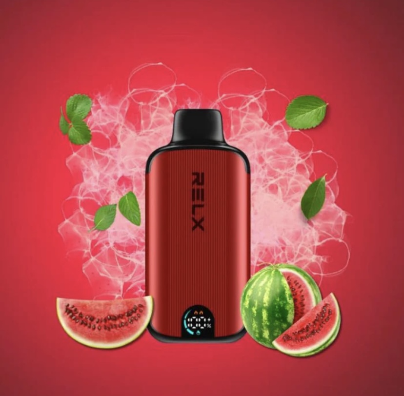 Red Relx Vape Device Featured with Watermelon Slices and Mint Leaves Against a Red Background with a Smoky Aura Suggesting Flavor - Australia E-cigarette Store