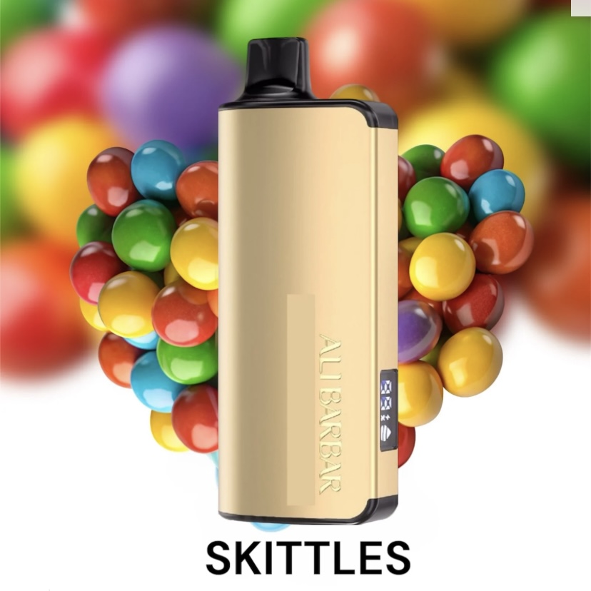 Gold Vape Mod Flanked by Colorful Skittles Candy on a White Background skittles Branding Visible Below - Australia E-cigarette Store