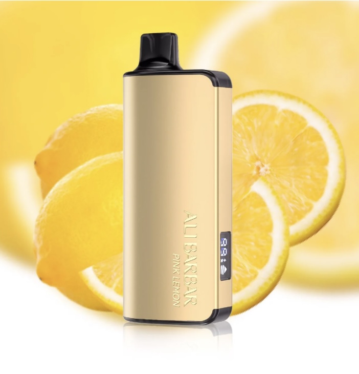 Gold Vape Device Standing Upright with a Black Mouthpiece Set Against a Bright Yellow Lemon Background with Lemon Slices Visible - Australia E-cigarette Store