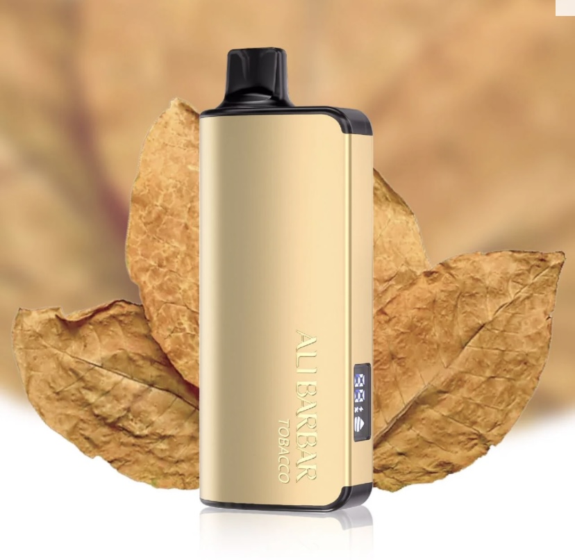Gold Vape Mod with Black Mouthpiece Standing Upright Small Side Display Set Against Brown Autumn Leaves - Australia E-cigarette Store