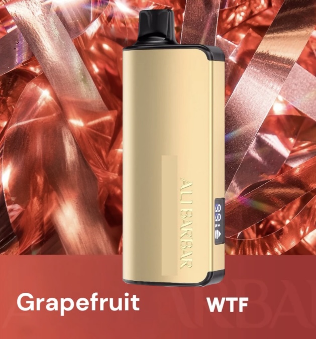 Gold Vape Device with Black Mouthpiece Standing Upright Against a Shiny Red Metallic Background Bottom Text Reads grapefruit and wtf Indicating Flavorname - Australia E-cigarette Store
