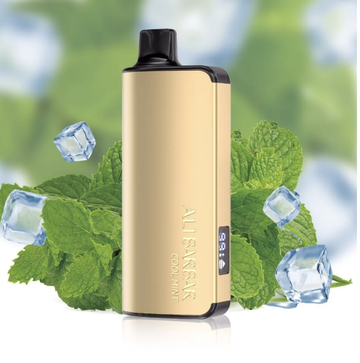 Gold Vape Device with Black Mouthpiece Standing Upright Among Mint Leaves and Ice Cubes Showcasing a Cool Mint Flavor Package Prop - Australia E-cigarette Store