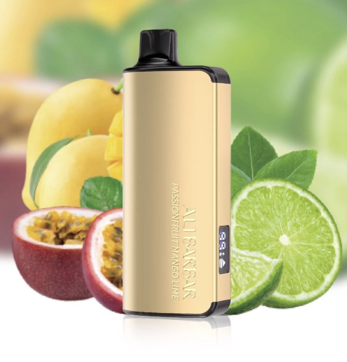 Gold Vape Mod with a Black Mouthpiece Set Against Citrus Fruits lime and Passion Fruit in a Blurred Background - Australia E-cigarette Store
