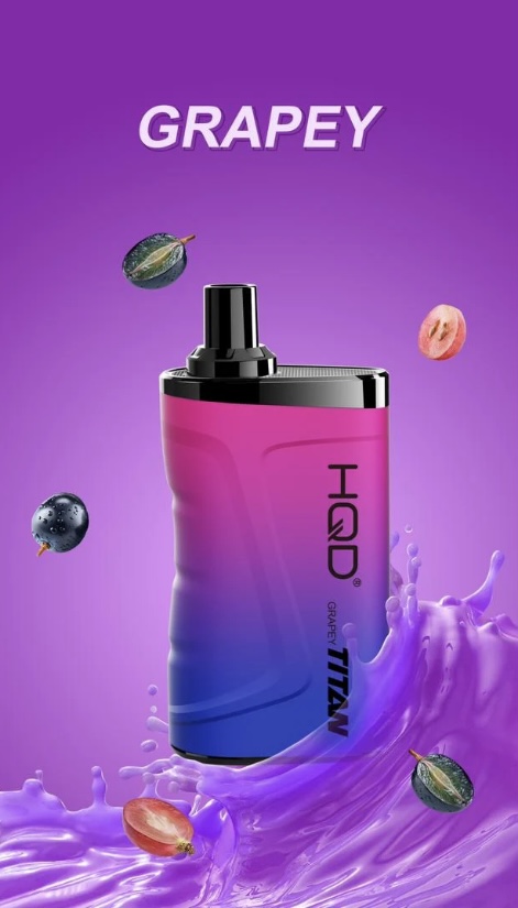Gradient pink-to-purple vape bottle labeled 'GRAPEY' with floating grapes and purple liquid splash on a purple background.