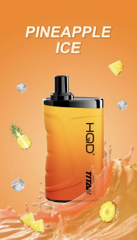 Orange gradient spray bottle labeled Pineapple Ice, surrounded by pineapple slices, ice cubes, and orange splash on an orange background.
