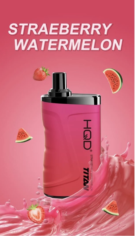 Bright pink IGD Titanium bottle with black cap, surrounded by strawberry and watermelon slices on a pink gradient background.