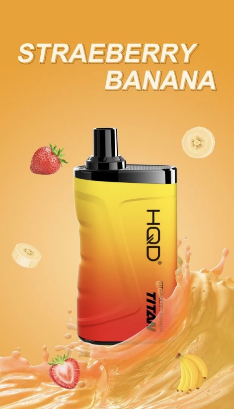Bottle of yellow-to-red flavored e-liquid with black cap, flavor strawberry banana, surrounded by strawberries, banana slices, and orange splash.