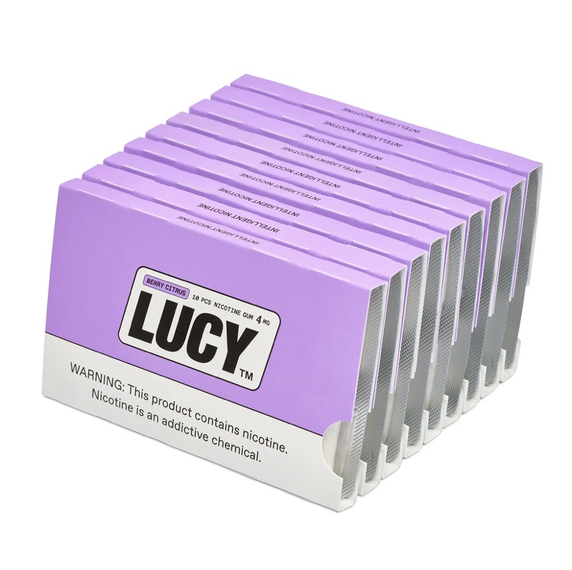 Purple Lucy nicotine gum boxes arranged in a row; bold LUCY logo on each sleeve, 4 mg each (berry citrus flavor). Includes warning label about nicotine addiction.