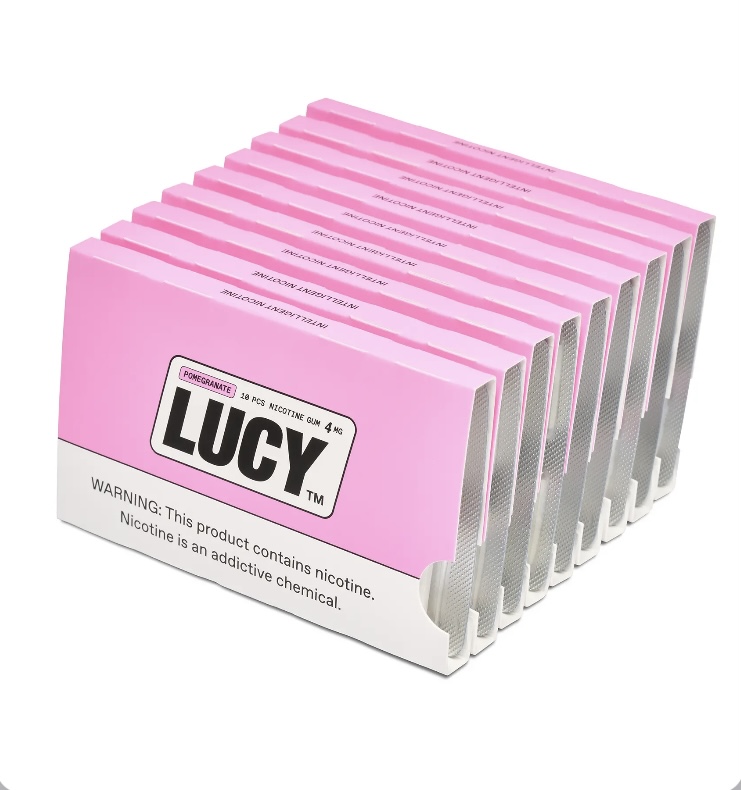 Row of pink Lucy nicotine gum packs labeled 4 mg, flavor pomegranate, in a white display tray.