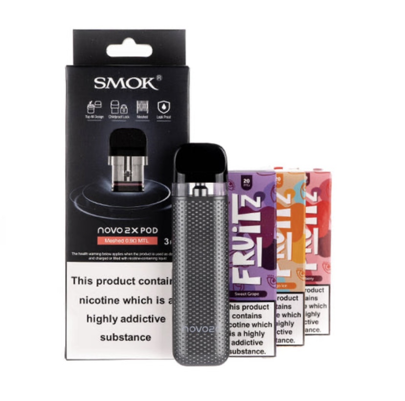 Smok Novo 2x Pod Kit Standing Upright Next to Three Colorful Flavored Vape Pods with Their Packaging Behind It Including a Nicotine Warning on the Box - Australia E-cigarette Store