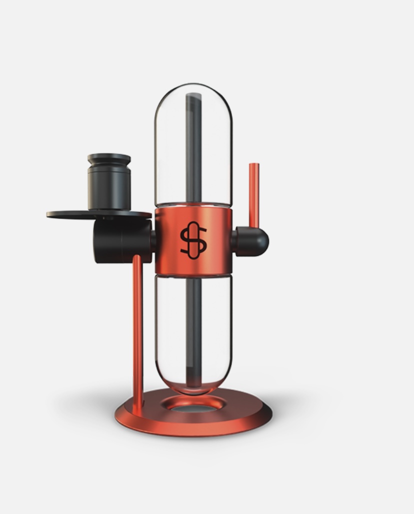 Red glass vacuum coffee siphon on a red stand, with black fittings and two glass chambers used for brewing coffee.