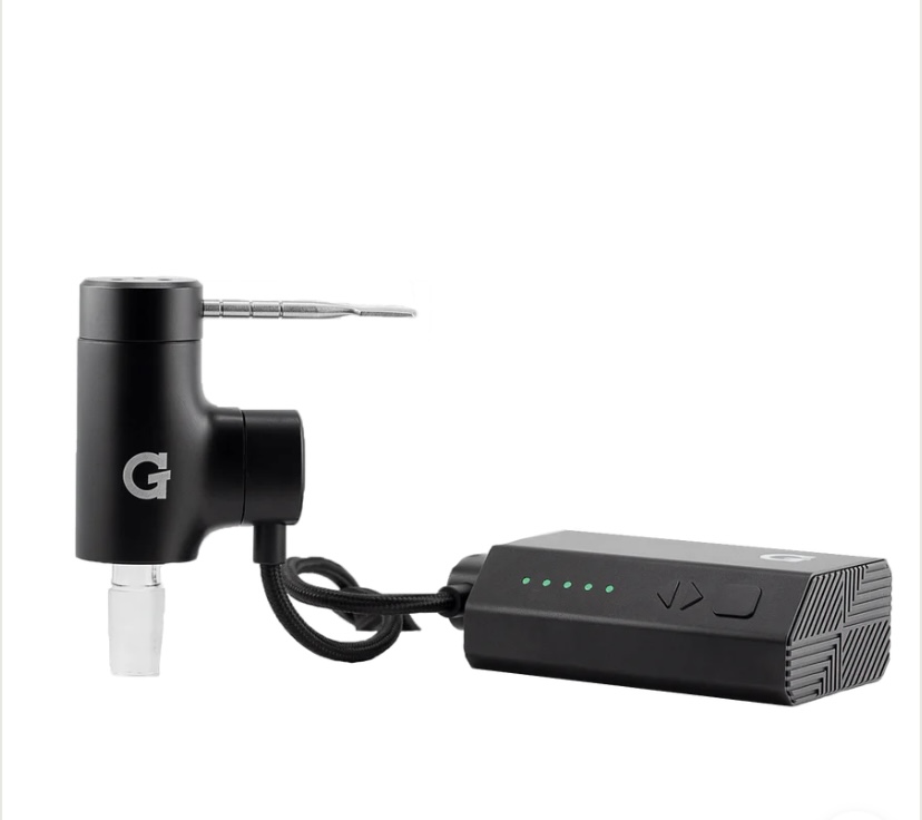 Compact black handheld tool with a short metal nozzle connected by a cord to a rectangular battery pack with green indicator lights.