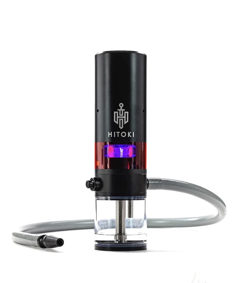 Hitoki Device Black Cylindrical Housing with a Clear Lower Chamber Glowing Purple Connected to a Gray Hose - Australia E-cigarette Store
