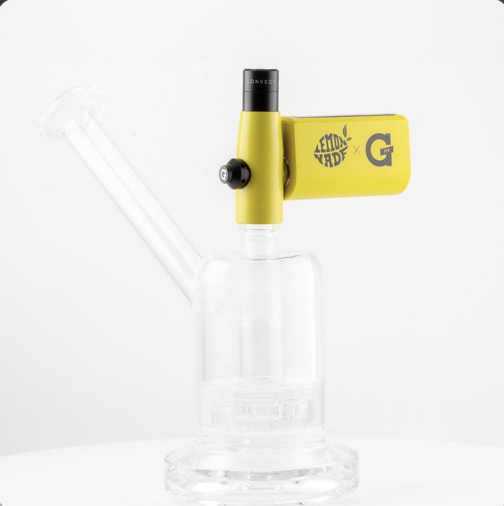 Clear glass bong with a yellow gadget mounted on the top, branded 'LEMONADE x G' on a white background, concise and informative