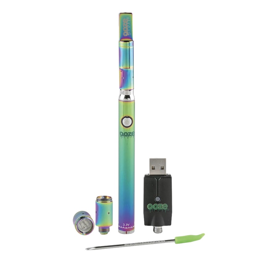 Rainbow-colored vape pen kit with USB charger and attachments (mouthpiece, chamber, and tips) for vaporizing concentrate.