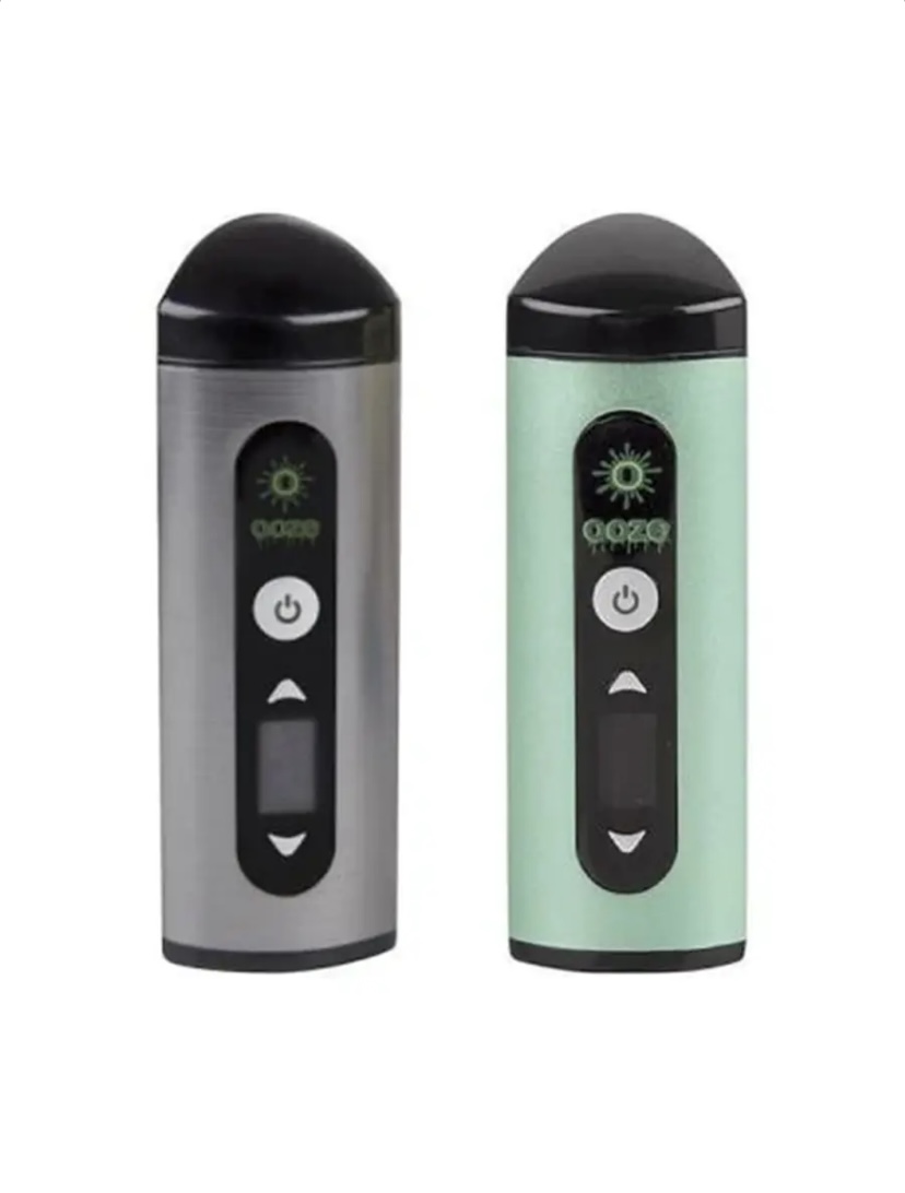 Two Cylindrical Vape Pens Standing Side by Side One Silver and One Mint Green Each with a Vertical Control Panel and Power Button - Australia E-cigarette Store