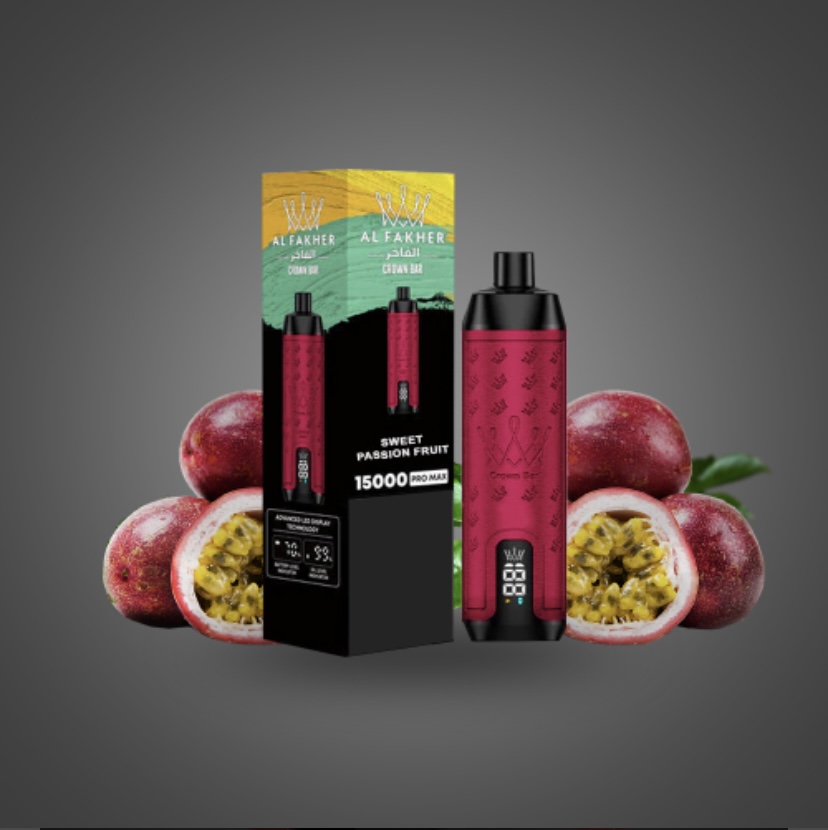 Pink and black vape device with its Al Fakher packaging, surrounded by passion fruits on a gray backdrop.