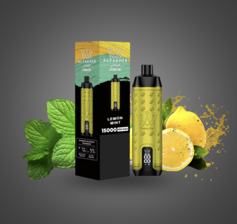 Vape Starter Kit with Lemon-mint Flavor Yellow-green Packaging and Two Devices Beside Mint Leaves and Lemon Halves on a Gray Background - Australia E-cigarette Store