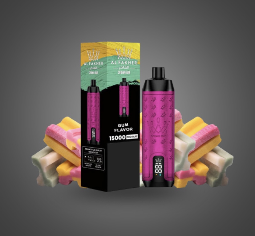 Pink Vape Pen Beside Its Black Packaging Labeled Gum Flavor 15000 Pro Max with Colorful Gummy Candies in the Background Against a Gray Gradient - Australia E-cigarette Store