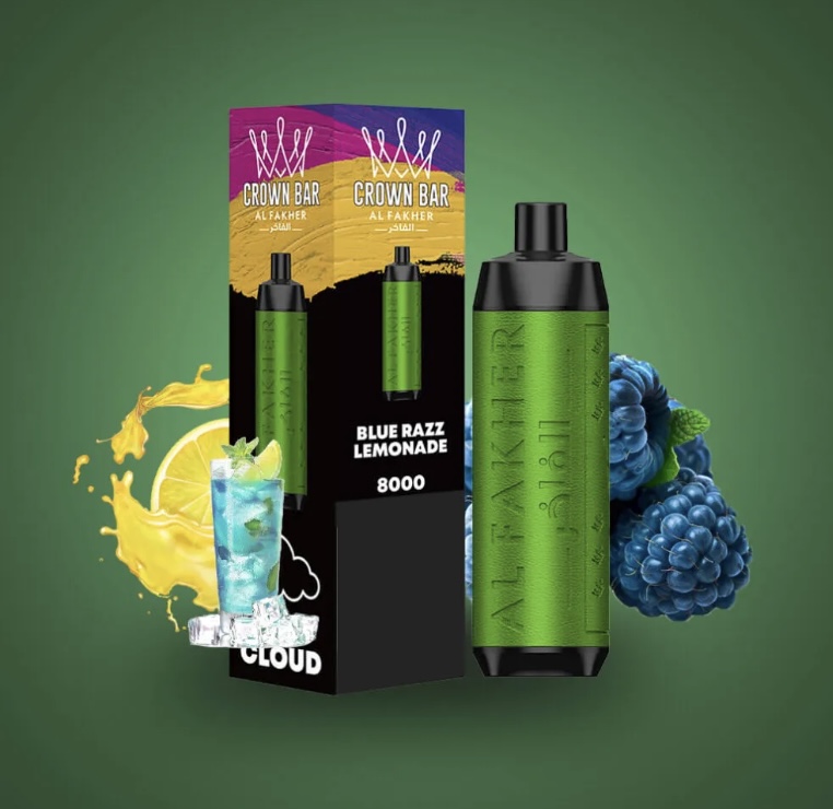 Green Crown Bar Vape Pod with a Textured Wrap Beside Its Black Packaging Labeled blue Razz Lemonade 8000 on a Green Gradient Backdrop with Fruit Accents lemon and Berries - Australia E-cigarette Store