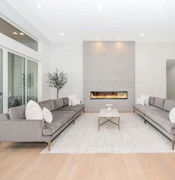 A ceiling-mounted downlight providing ambient lighting in the living room.