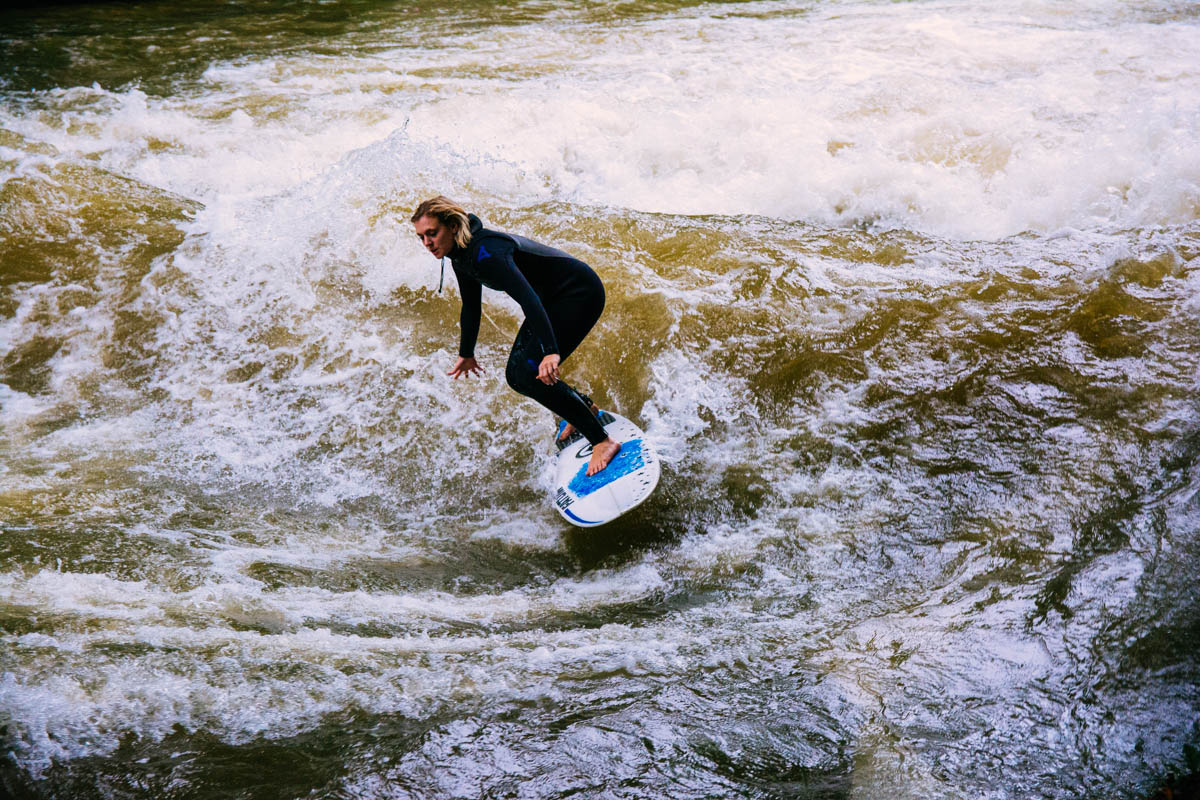 Surfing on the Eisbach river in the Englischer Garten