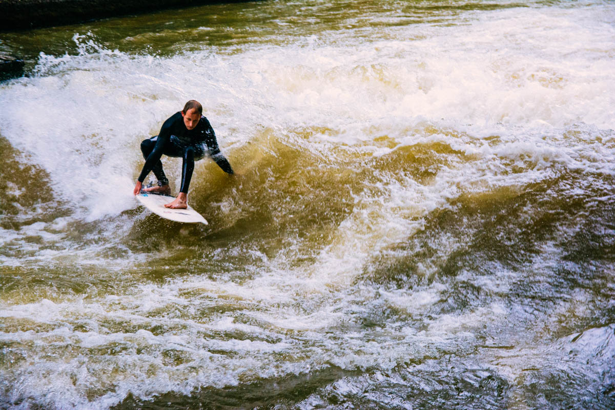 Surfing on the Eisbach river in the Englischer Garten