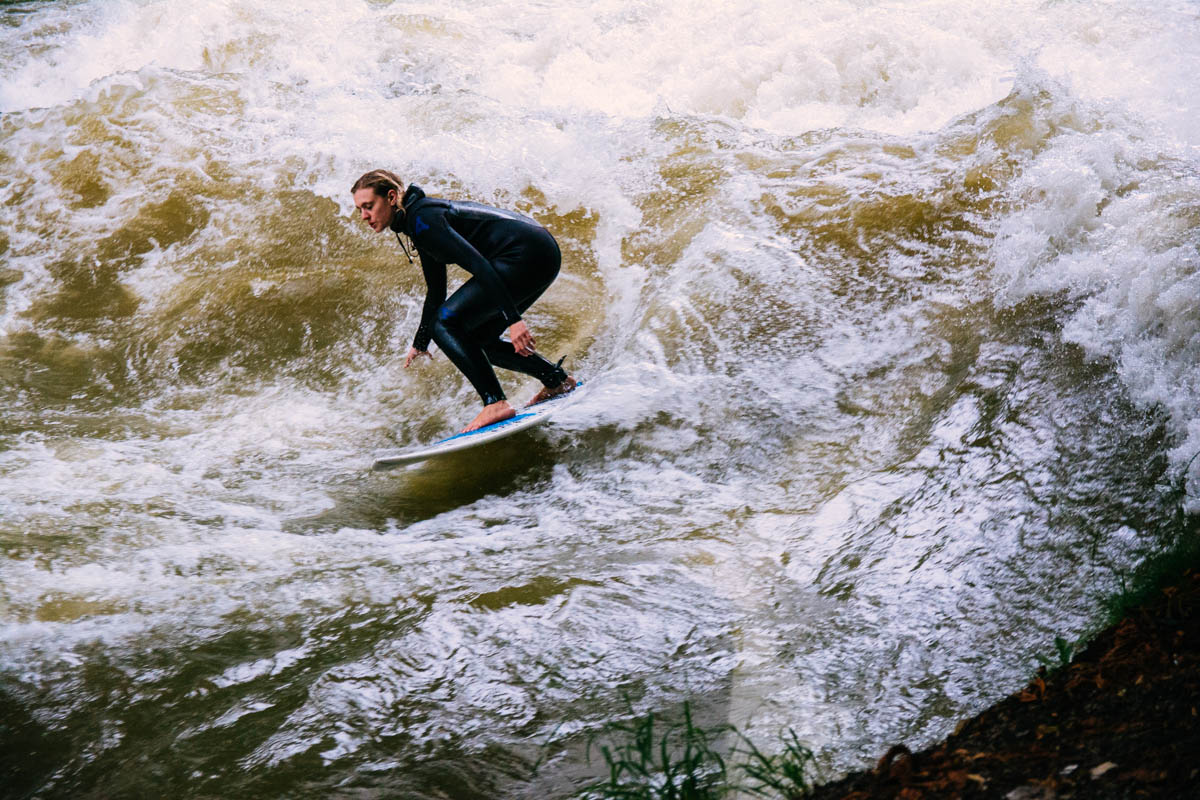 Surfing on the Eisbach river in the Englischer Garten