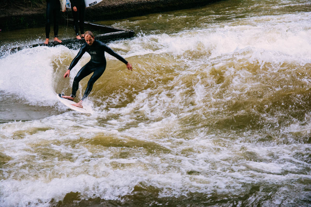 Surfing on the Eisbach river in the Englischer Garten