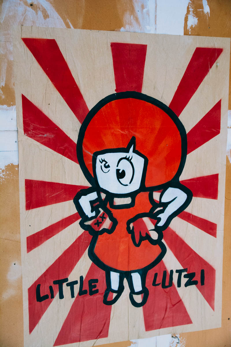 Little Lutzi and her cat used to be characters in cartoon about communist Germany, today there's lots of street art of her killing her cat in different ways