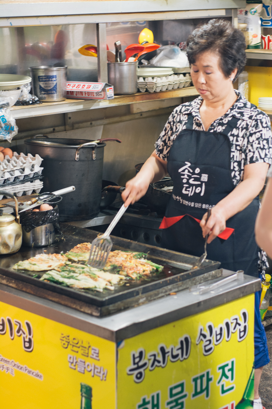 An Agjima making Jeon, Korean pancake
