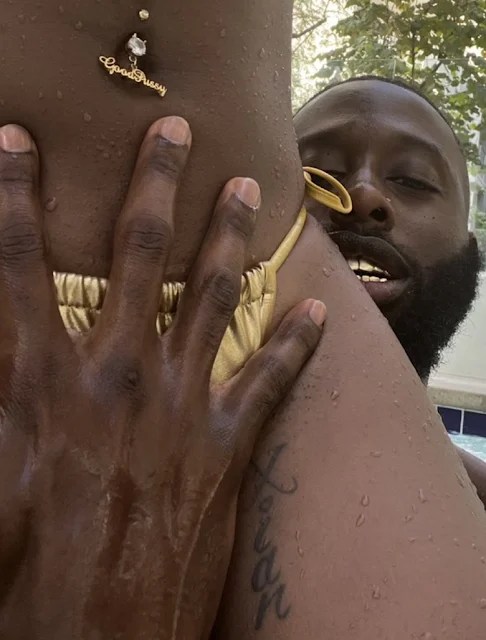 Close-up of a man's hand on a woman's body, capturing an intimate moment with passion and desire.