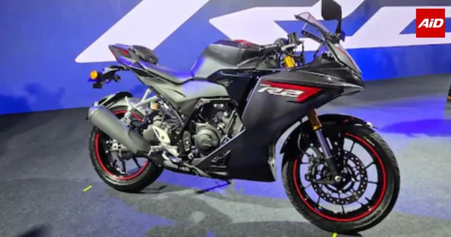 Yamaha YZF-R2 sports bike displayed on stage in a black colour scheme with red accents.