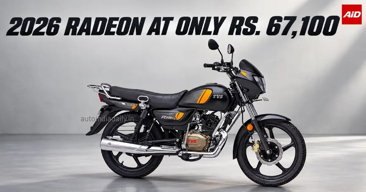 2026 TVS Radeon launched in India at Rs. 67,100 with black and orange styling in a grey studio background