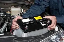 AutoTrust Mechanic Replacing Car Battery