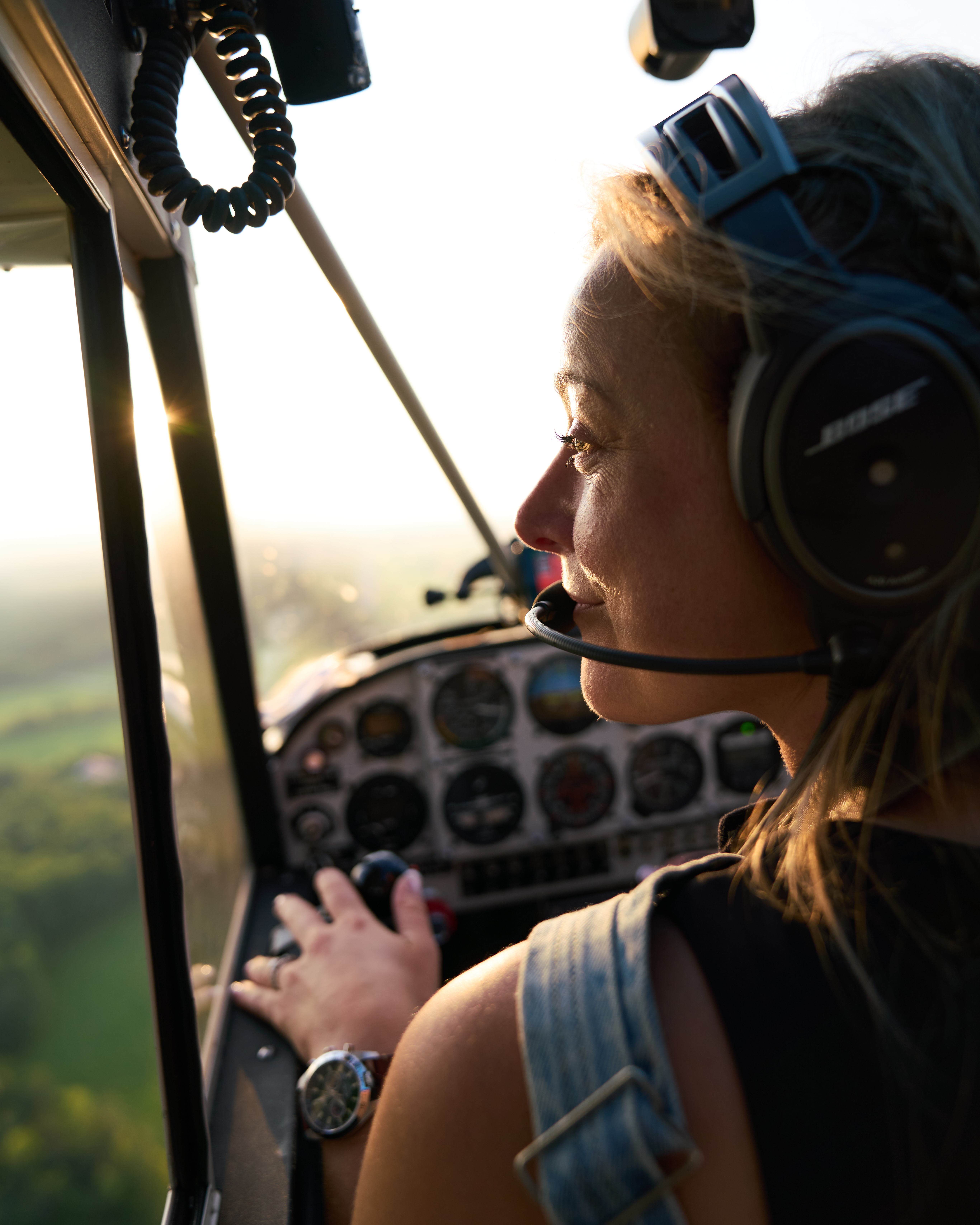 woman flying in airplane looking left