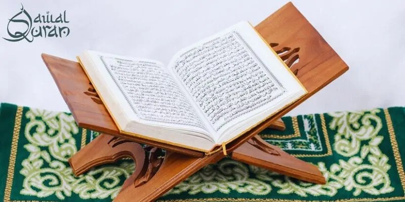 Quran displayed on a wooden stand, accompanied by Tafseer for deeper understanding of the text.