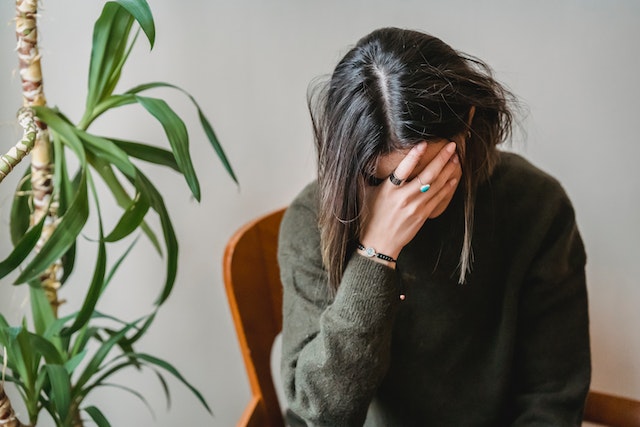 A person with a sad expression reflecting the consequences of investment mistakes.