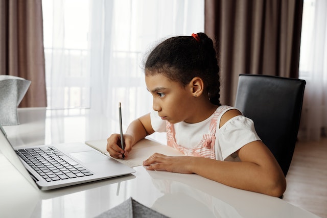 A focused student analyzing facts for successful and profitable investments.