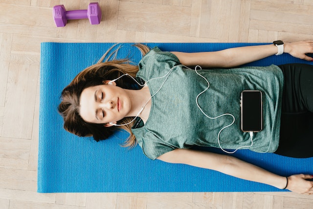 A woman practicing mindfulness and meditation, finding peace and focus in her financial journey.