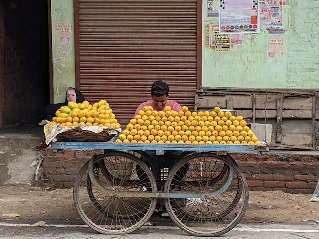Street Entrepreneur Selling Oranges